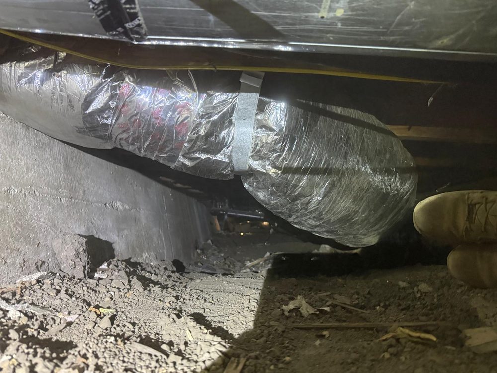 Flexible ductwork running through a residential crawlspace